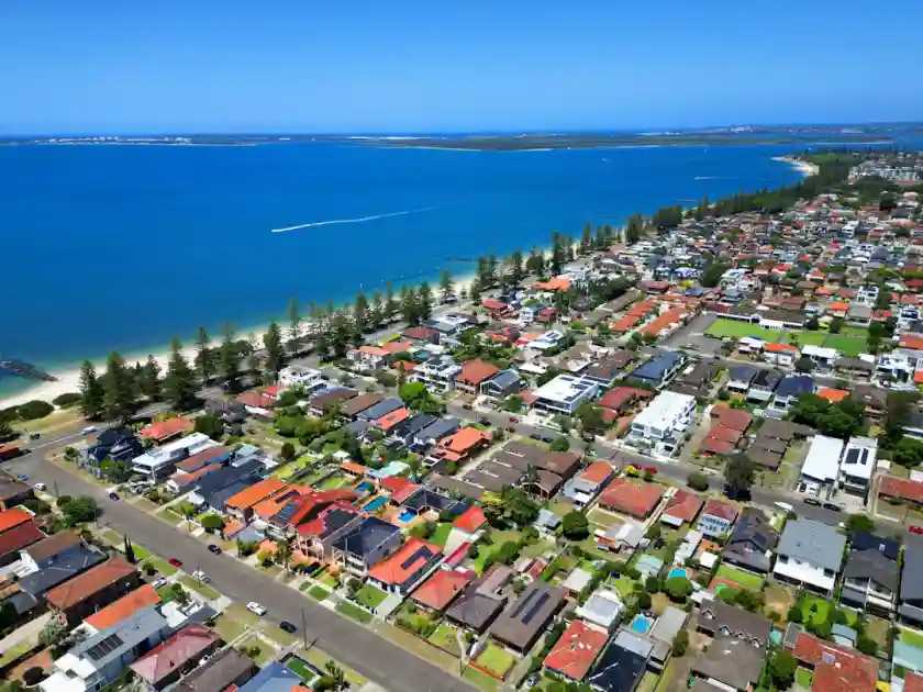 An aerial view of a city by the ocean
