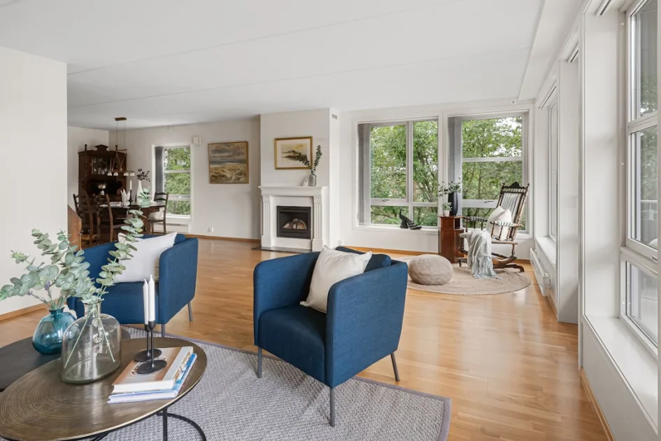 A living room filled with furniture and a fire place
