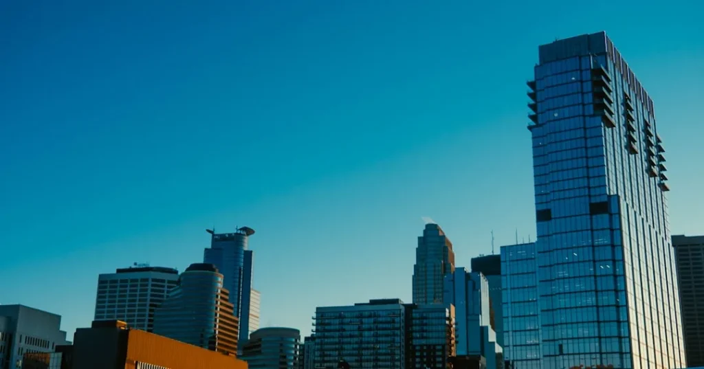 a city skyline with tall buildings in the foreground
