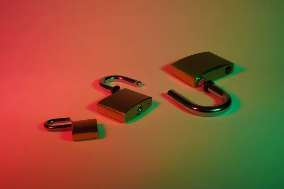 green and silver padlock with keys